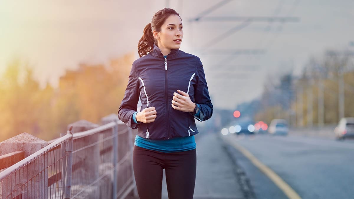 Fitness woman jogging in winter