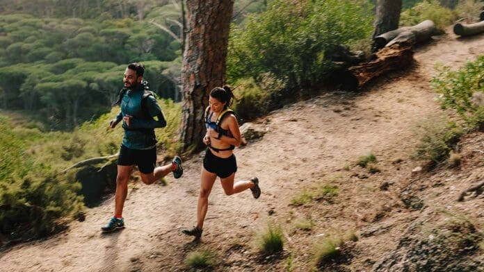 Young couple doing trail running workout
