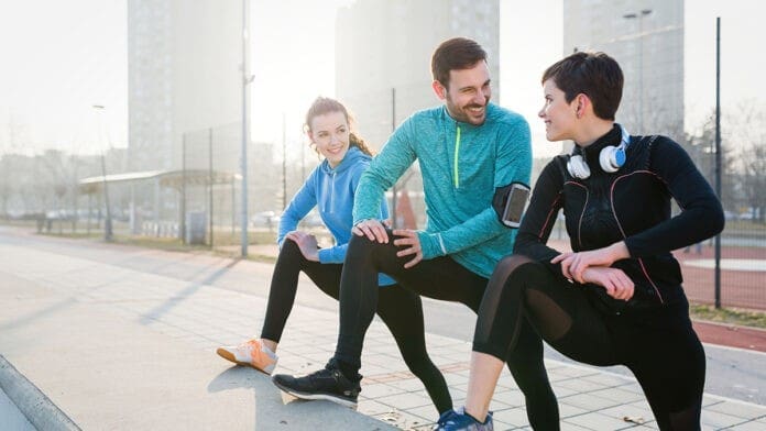 Friends fitness training together outdoors living active healthy